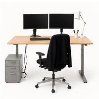 Light timber rectangular height adjustable desk. 1400mm x 700mm